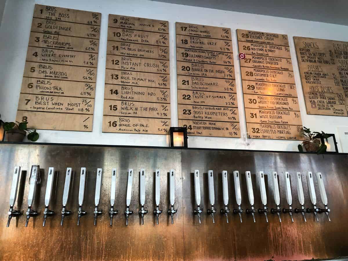 Beer taps on a wall at a bar in Copenhagen