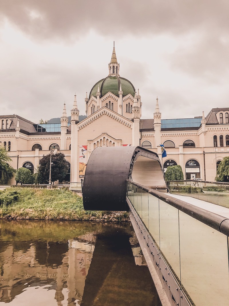 solo travel experience, view of an old stone building with a domed roof