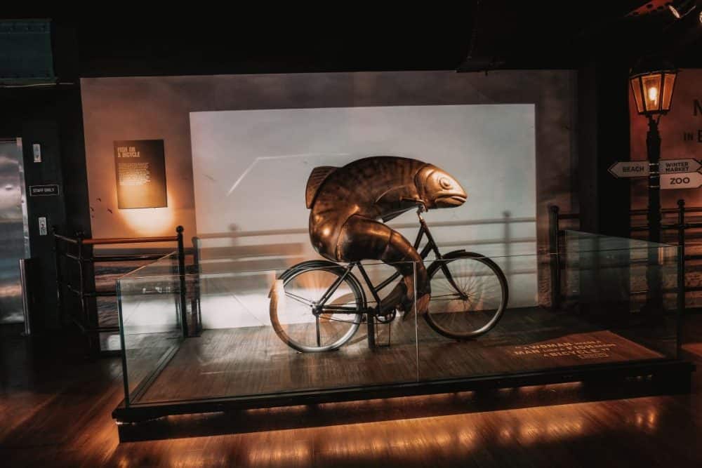 A Weekend in Ireland at Guinness, a statue of a fish riding a bicycle