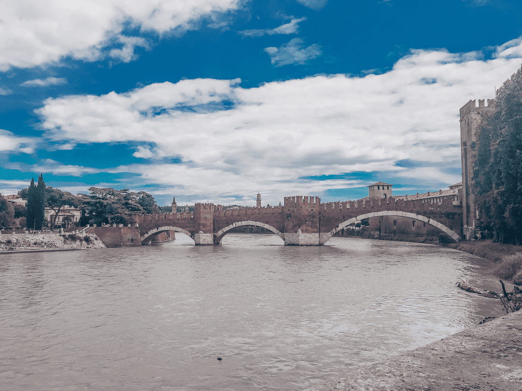 Best travel destinations for solo women, a bridge over the river in Verona, Italy.