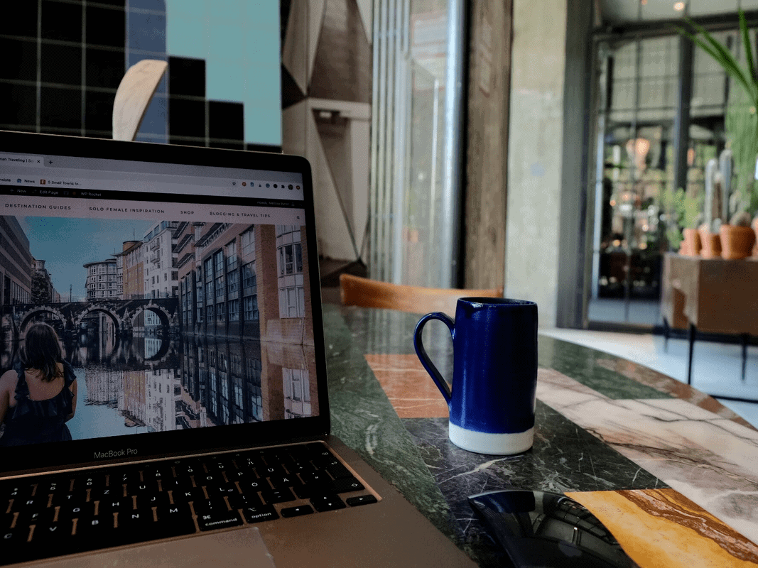 A coffee and laptop resting on a table in The Store, one of the best cafes to work in Berlin.