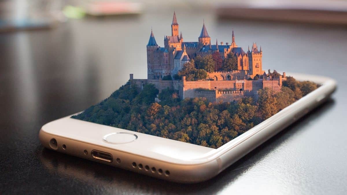 Travel Planning Apps. A castle edited to look like it's coming out of a phone screen.