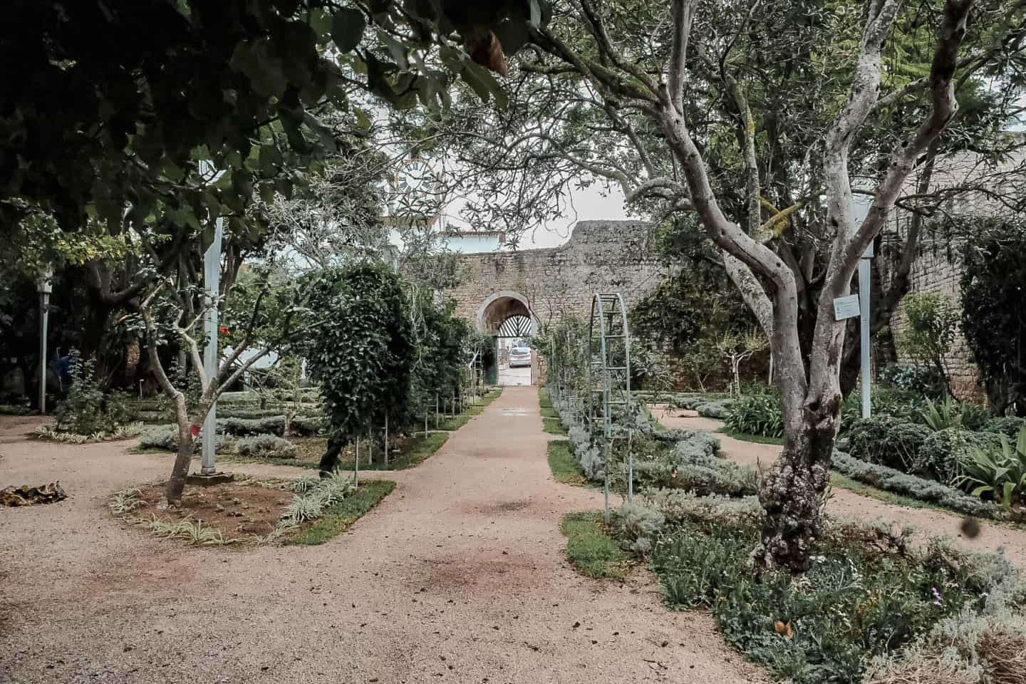 Garden walkways inside stone walls at the Castelo de Tavira.