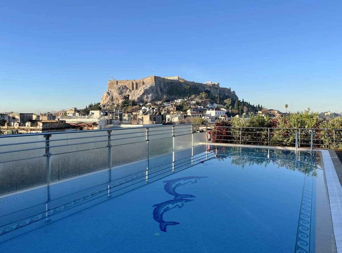 Rooftop pool at Electra Palace Hotel with view of the acropolis in the background