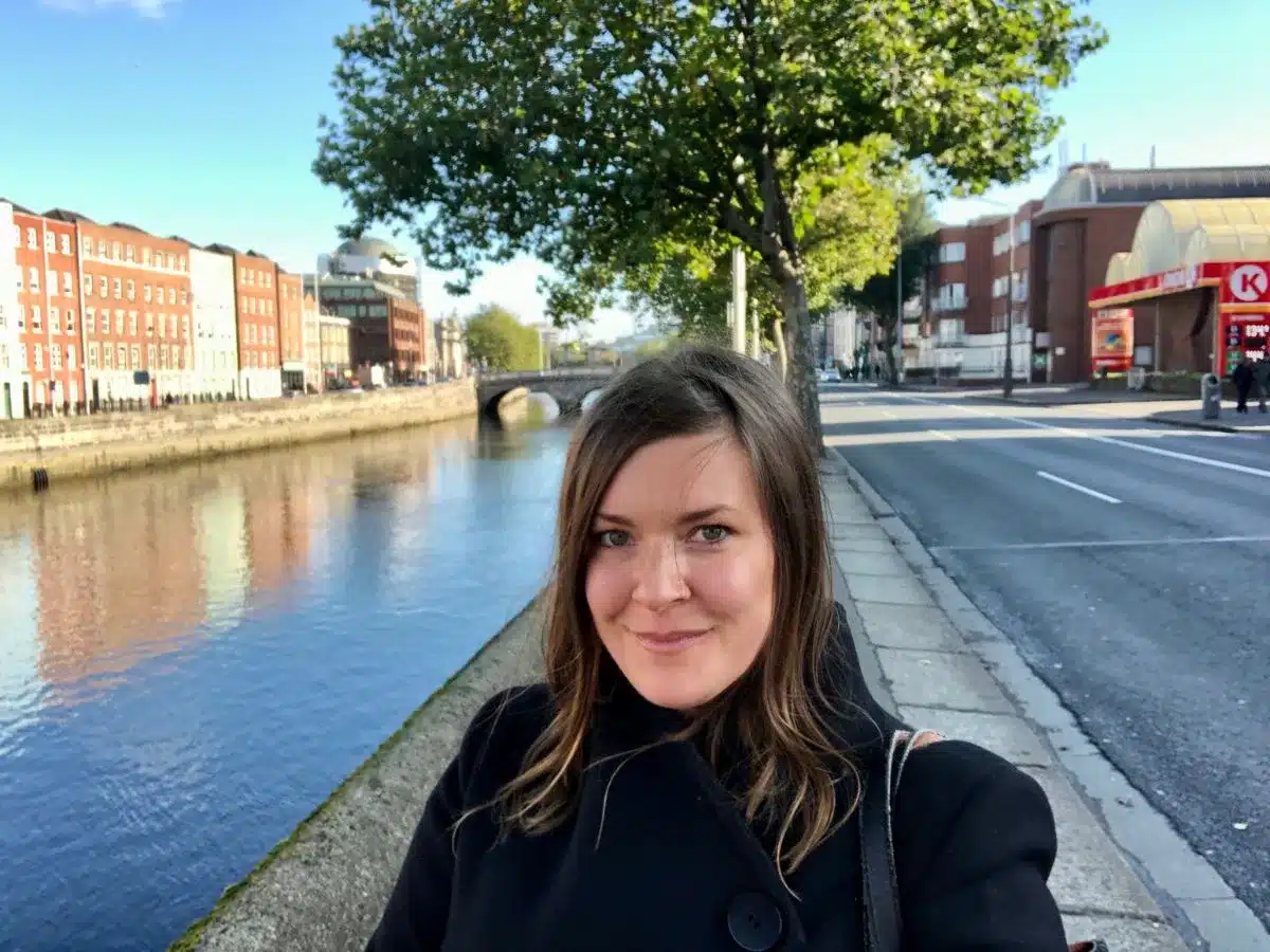 A solo female traveler walking on a street in Dublin, capturing the essence of solo travel in Dublin.