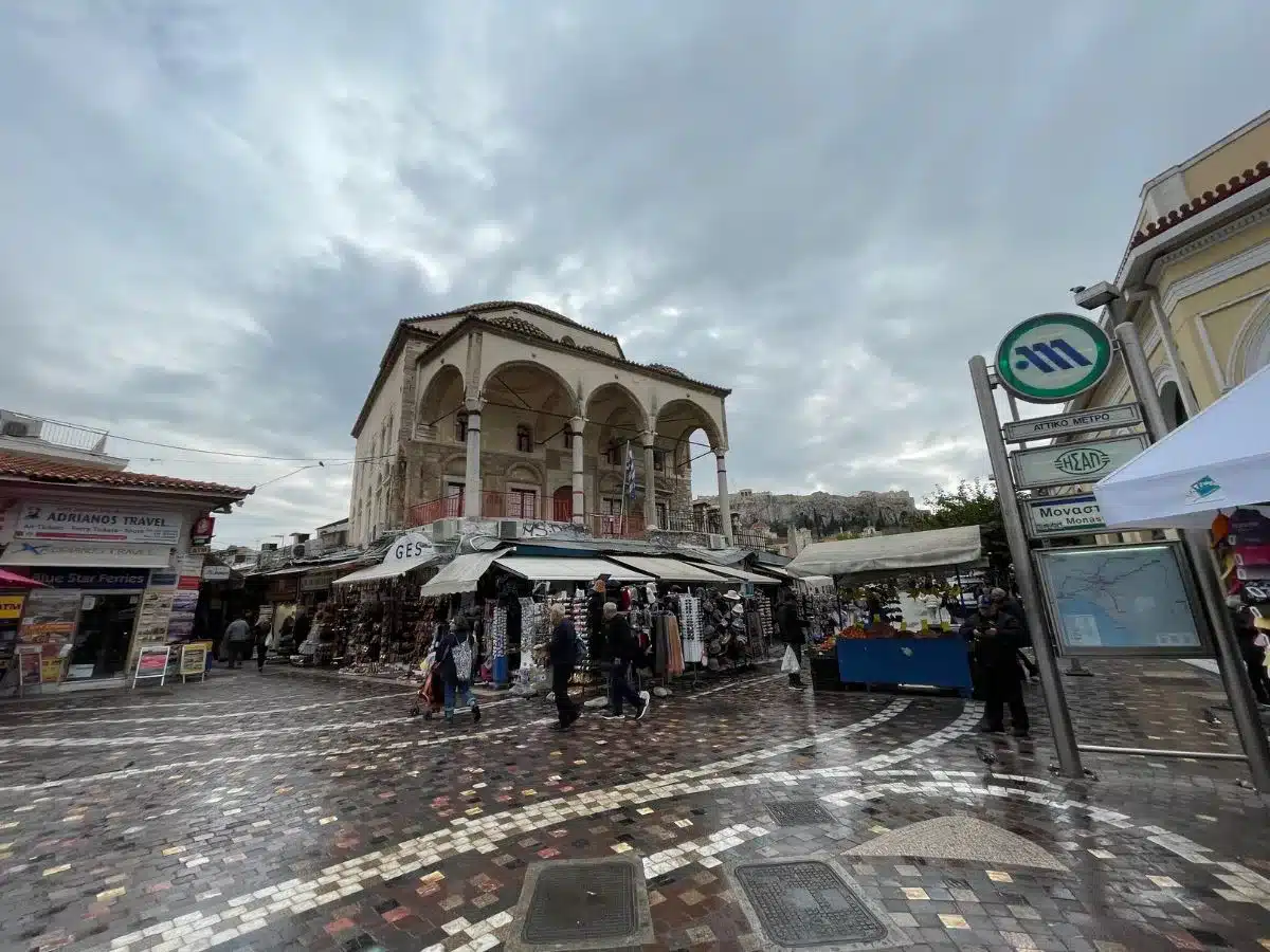 A picture of a busy shopping area in Athens Greece on a cloudy day.
