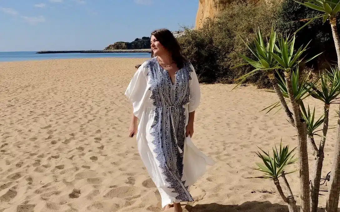a woman solo on the beach in the algarve