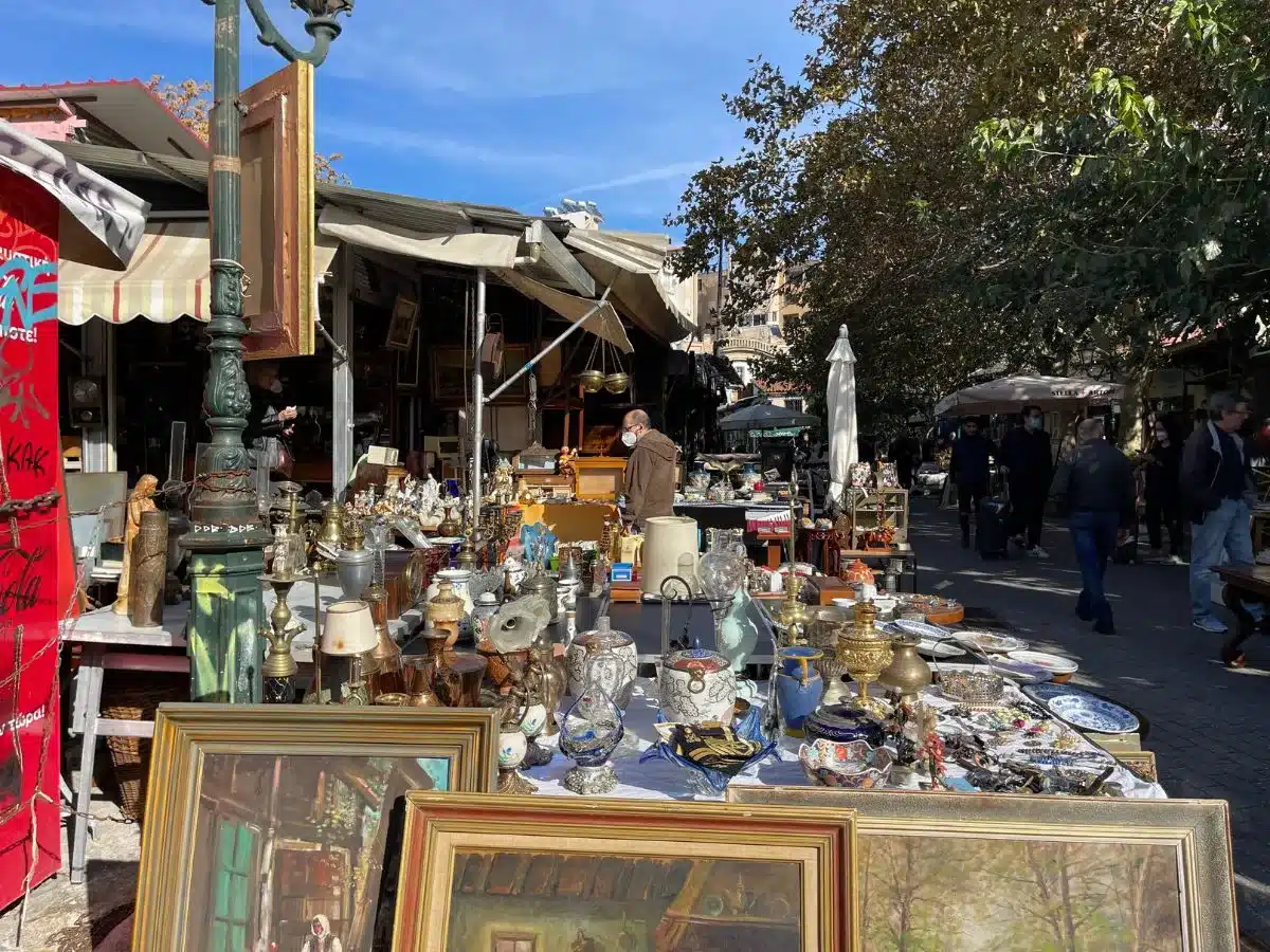 Lots of antiques on a table at the Flea market