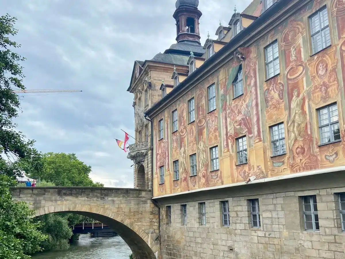 he ornate frescoes of the Old Town Hall in Bamberg, spanning over the Regnitz River, a sight to behold for those on a cultural day trip from Nuremberg.