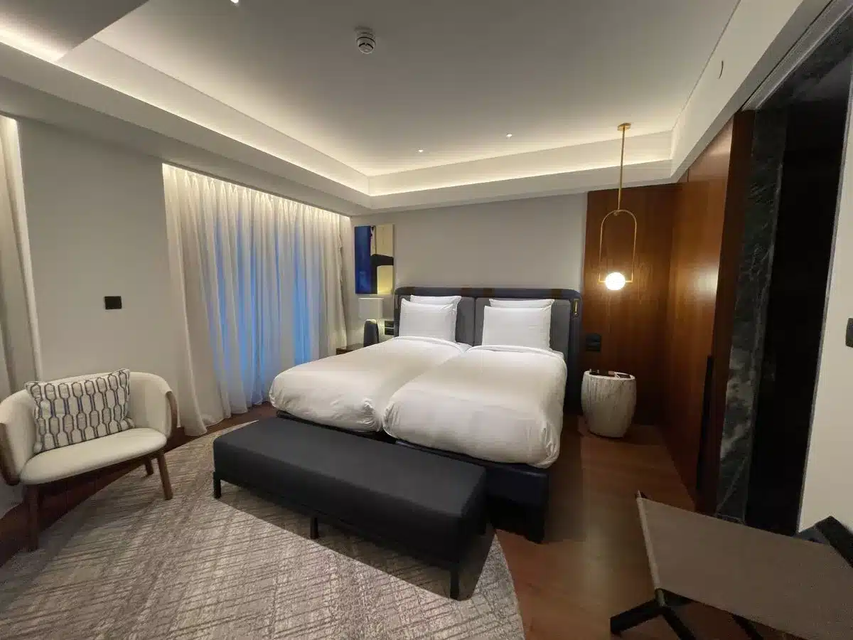 A modern Hotel Room with bed and chair picutred