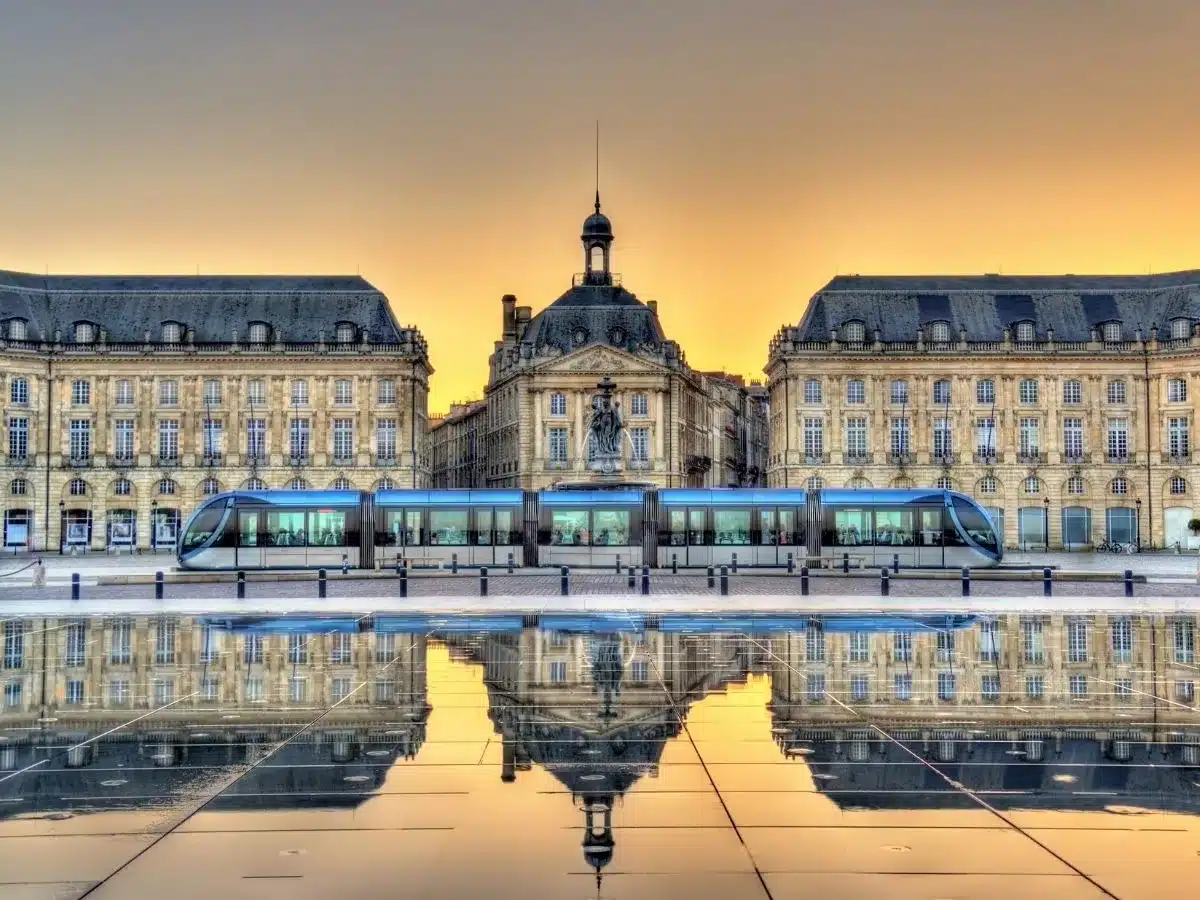 Picture of the building in france against the largest reflecting pool in Bordeaux