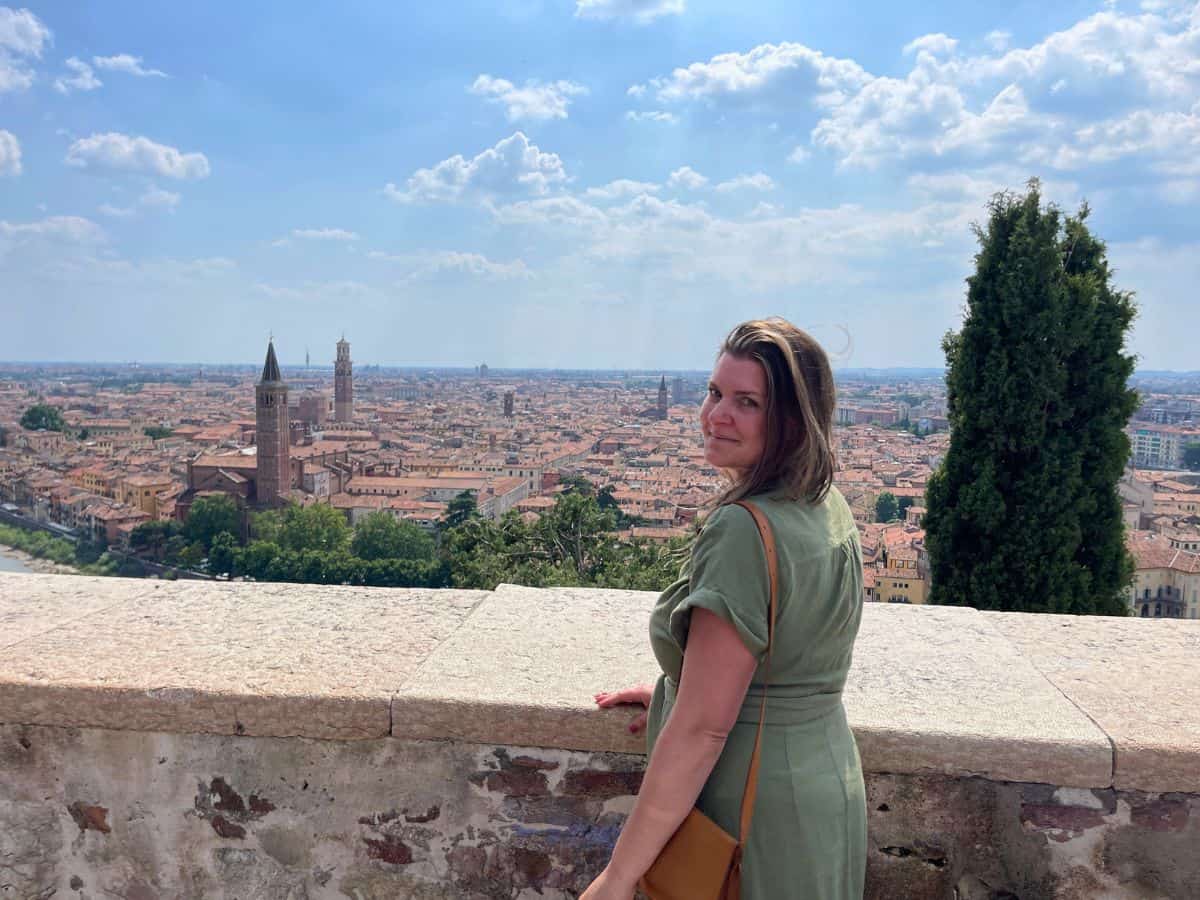 A Solo Woman Traveling looking over the city of Verona