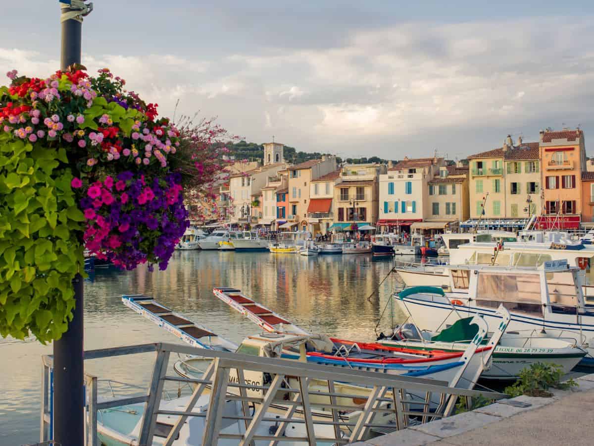 Port of Cassis, France. Colorful building along the port with boats lining the way.