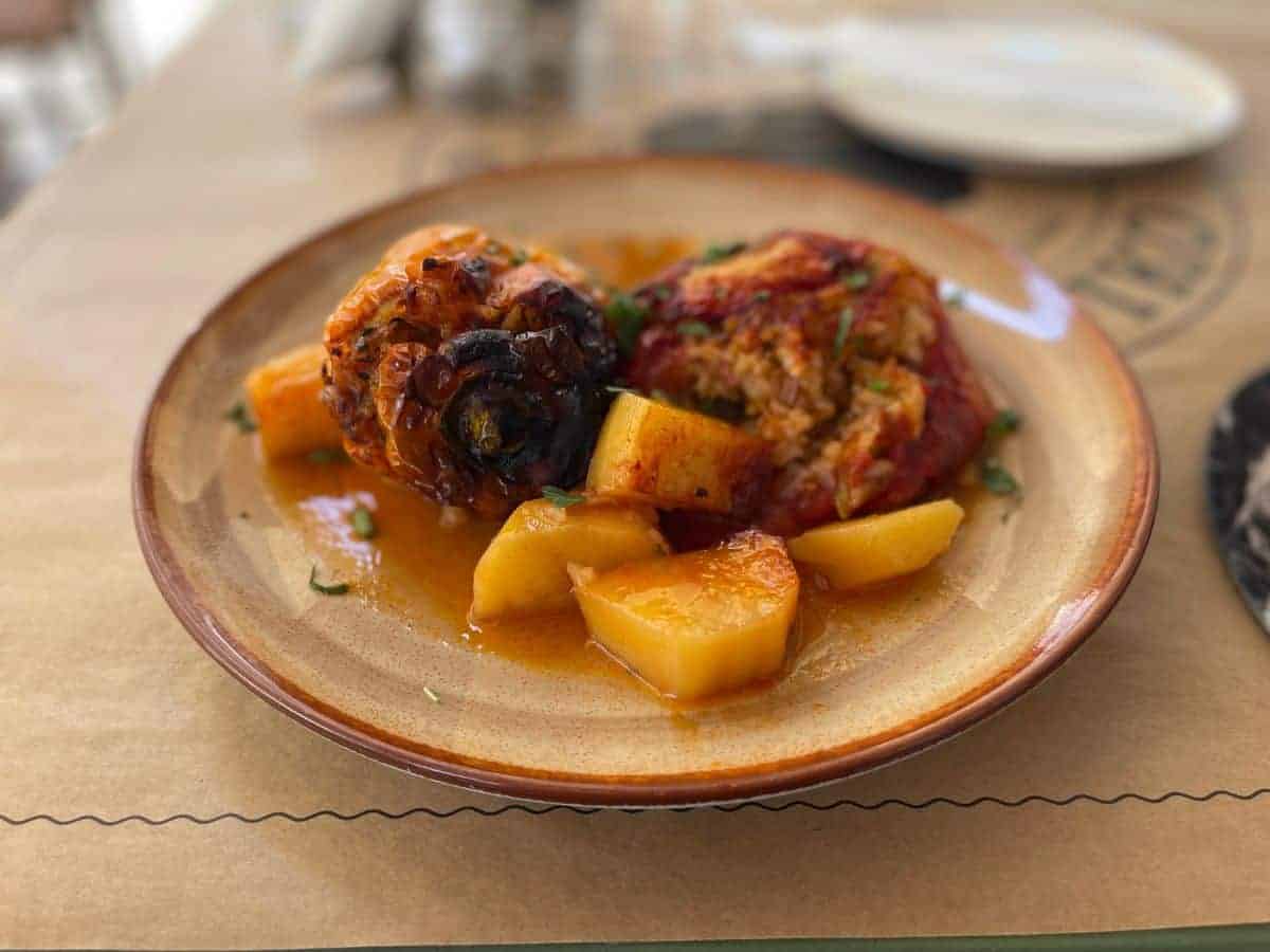 Traditional Greek food of stuffed tomatoes and potatoes on a plate