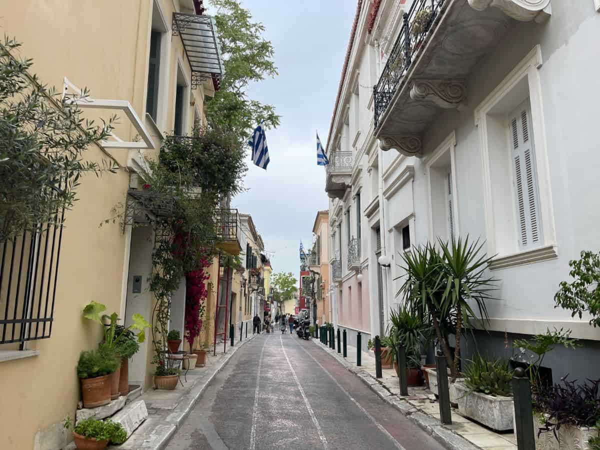 A street lined with planets, apartments and greek flags. A great free thing to do in Athens on a budget