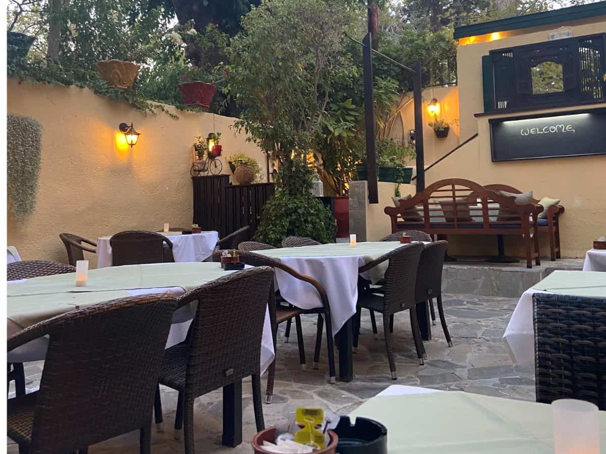 Interior of a restaurant with table and chairs on the best greek islands for foodies