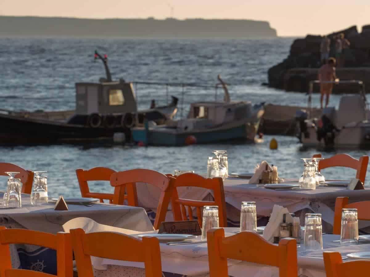 Dining tables by the sea in Santorini