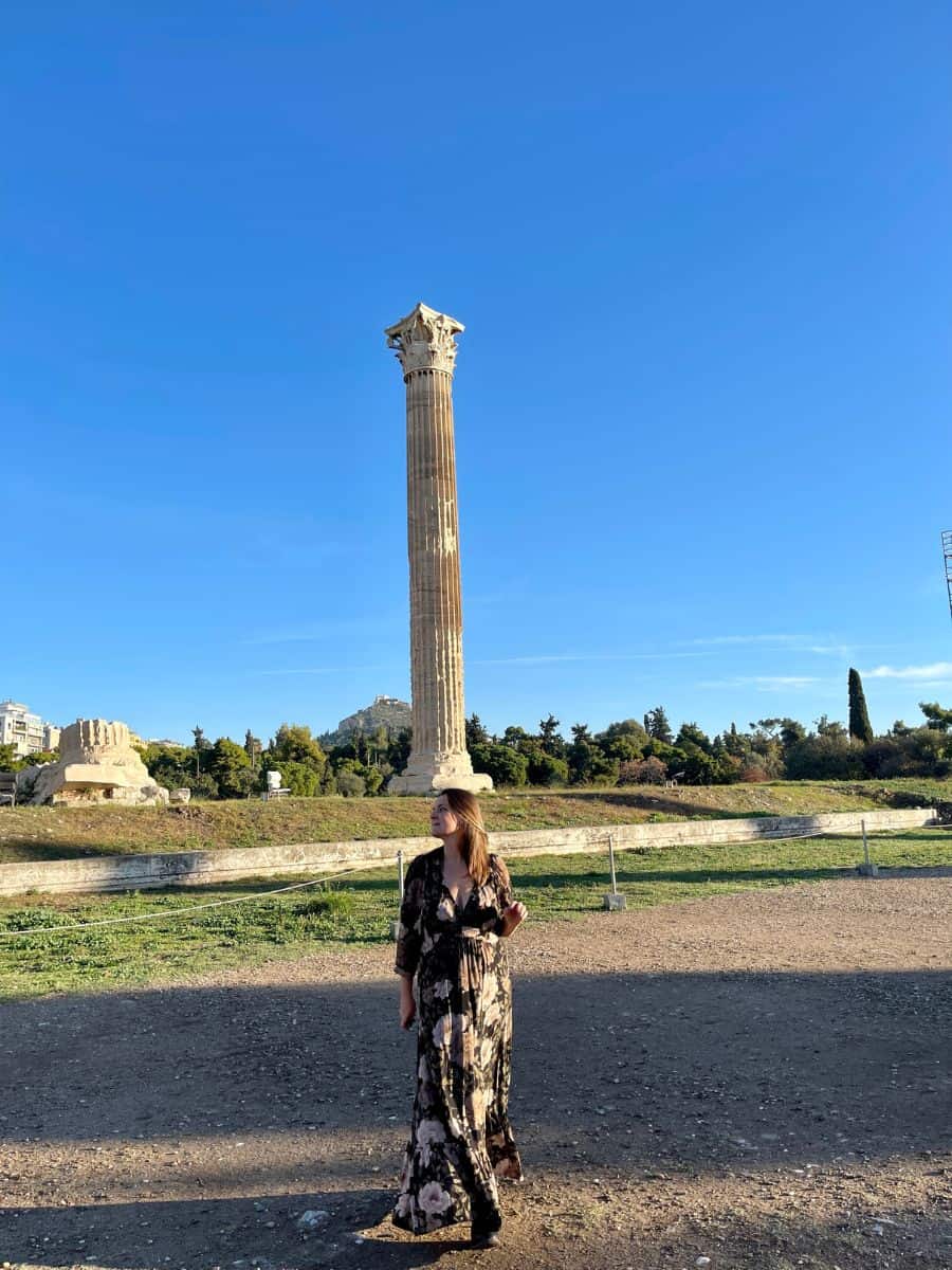 A woman in front of the columns at the Temple of Olympian Zeus