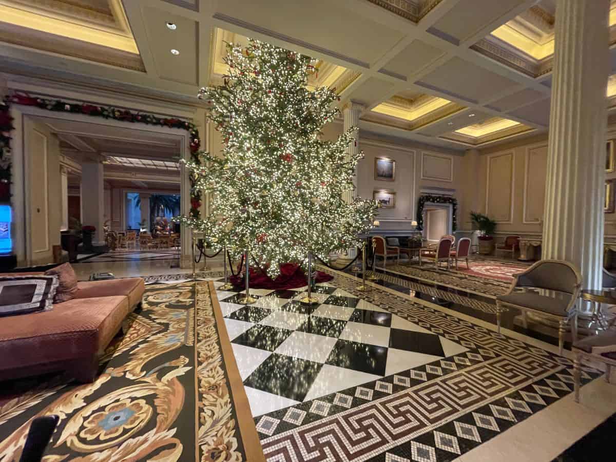 A fancy Athens Hotel Lobby in December with a large christimas tree