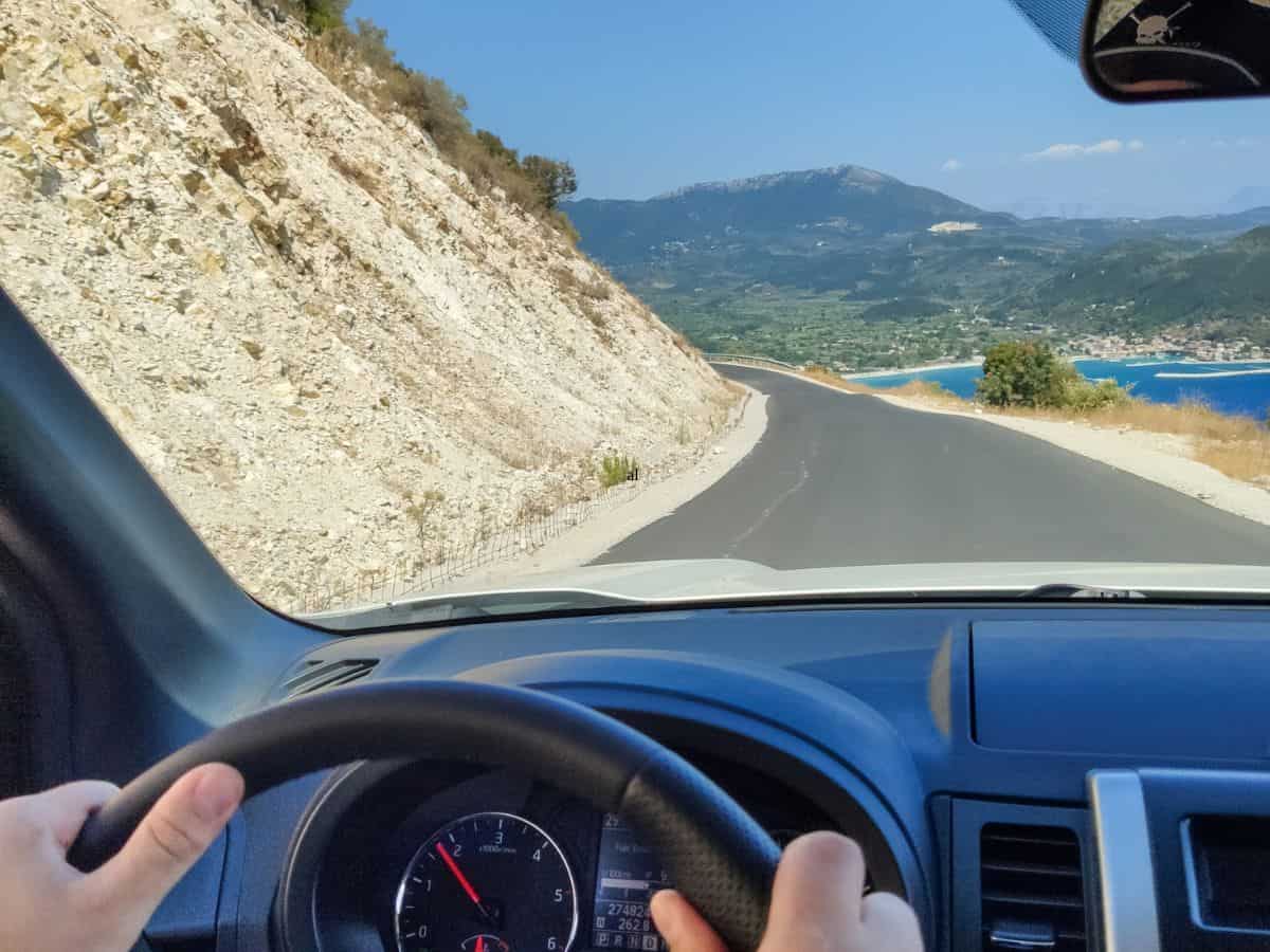 A woman behind the wheel of the Corfu rental car