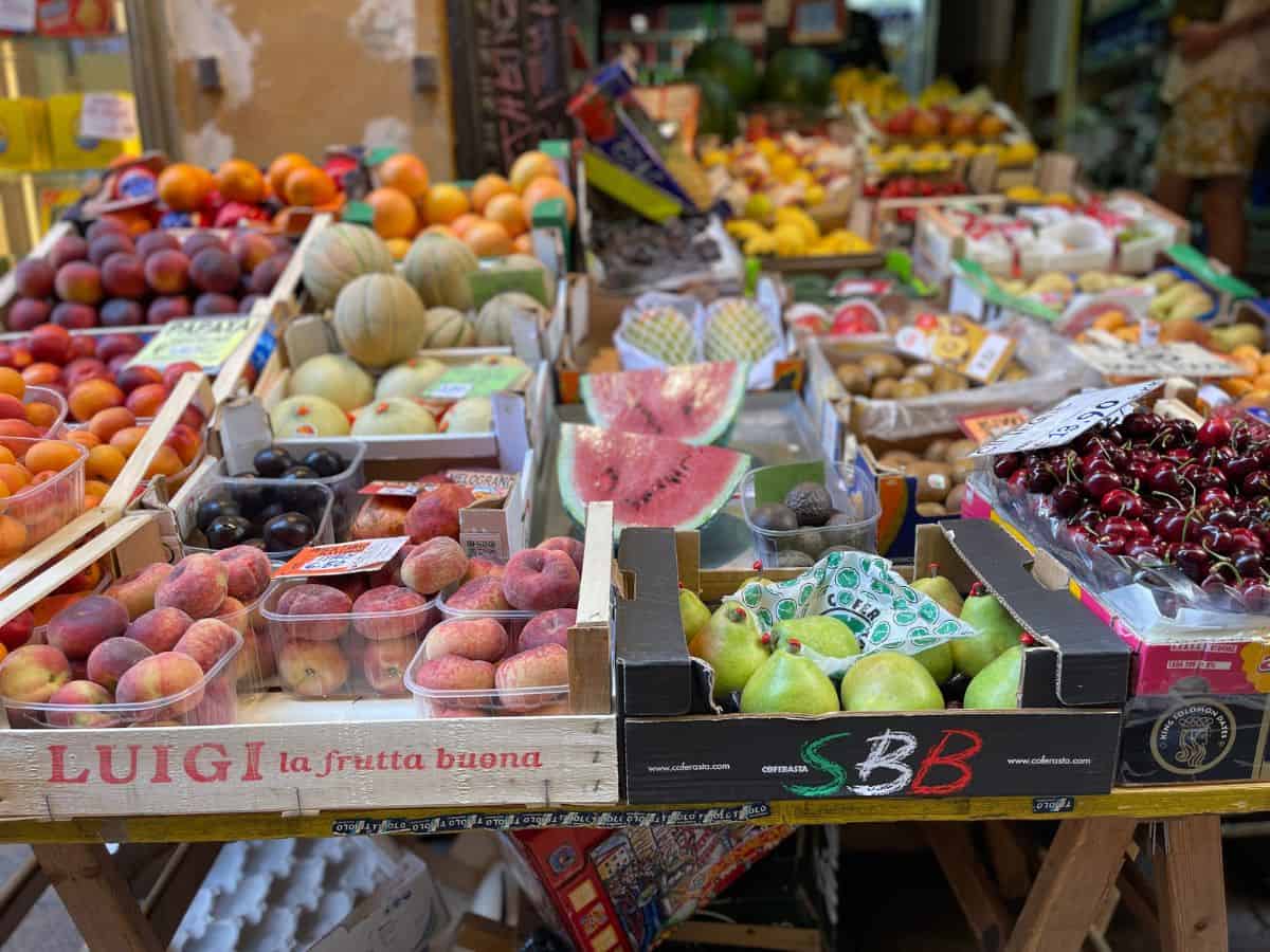 Peaches, pears and cherries at the famous food market street in Bologna