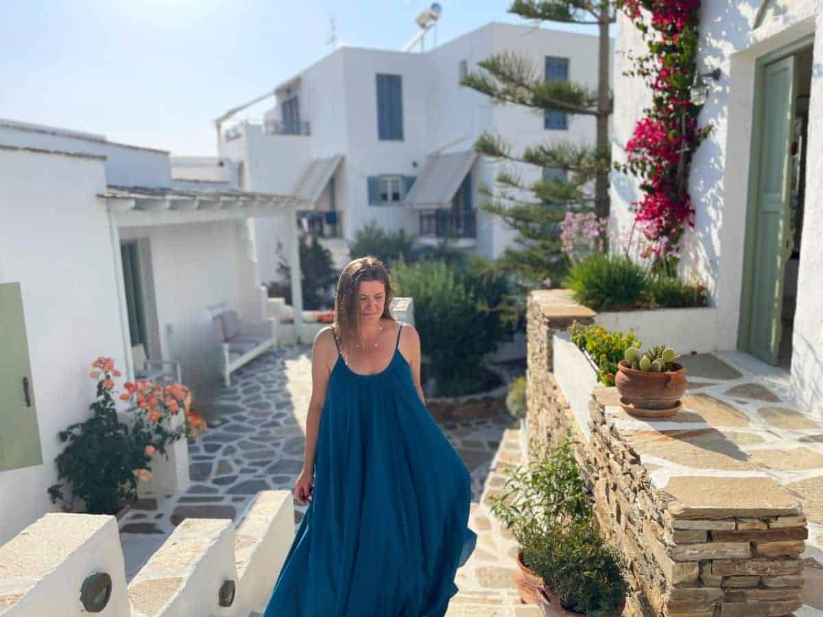 A solo woman traveling in Naxos coming up the stairs of the hotel