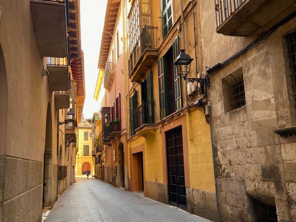 Exploring the streets of spain solo. The empty street in Majorca spain with colorful houses