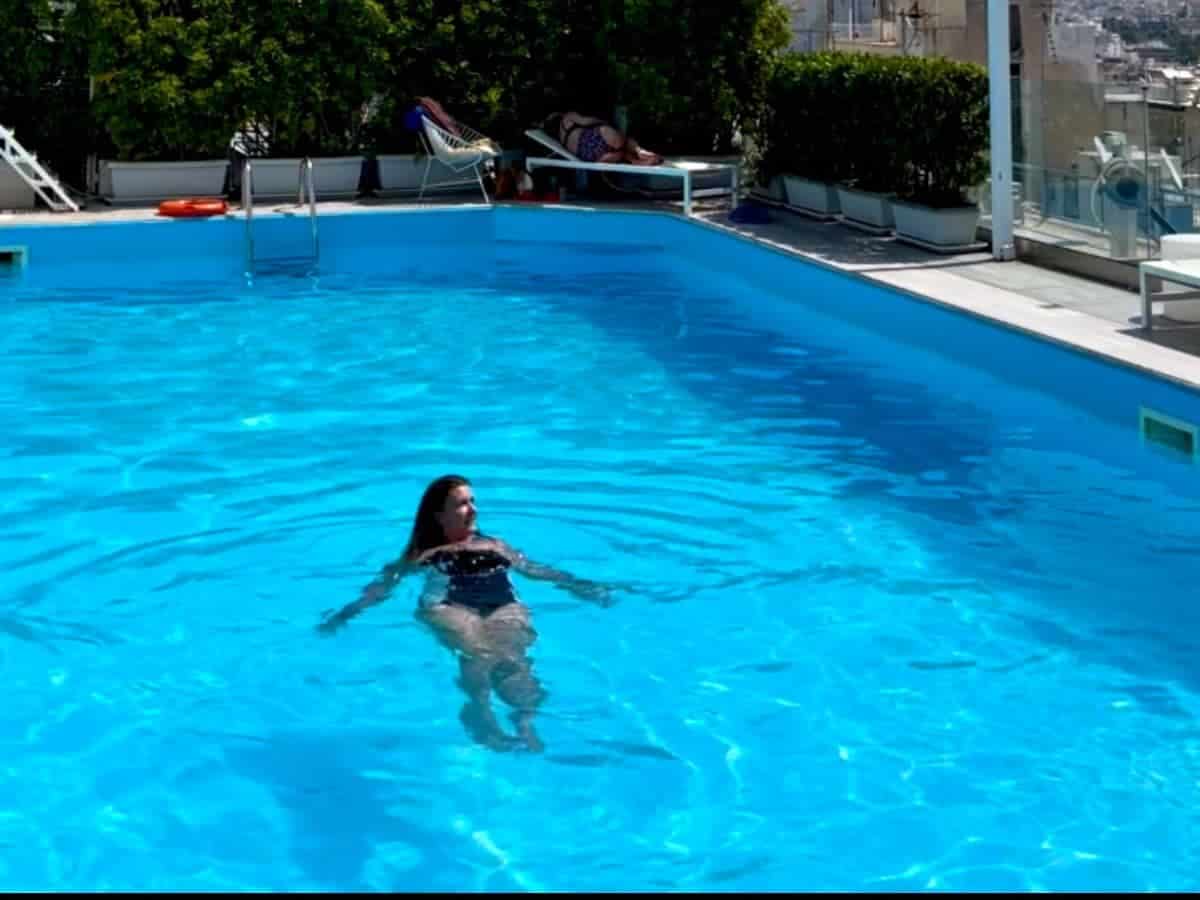 A woman swimming in a pool in Athens
