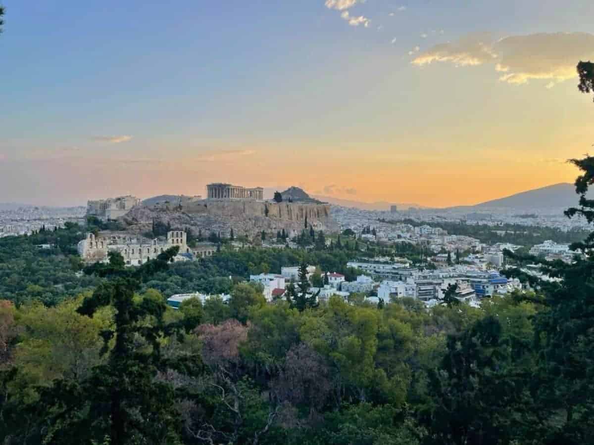 A picture of Athens from a distance at sunrise.