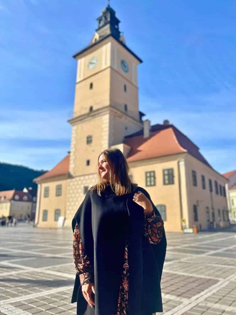 Is romania safe for solo female travellers?
A Solo woman traveling in Romania with the old church in the background