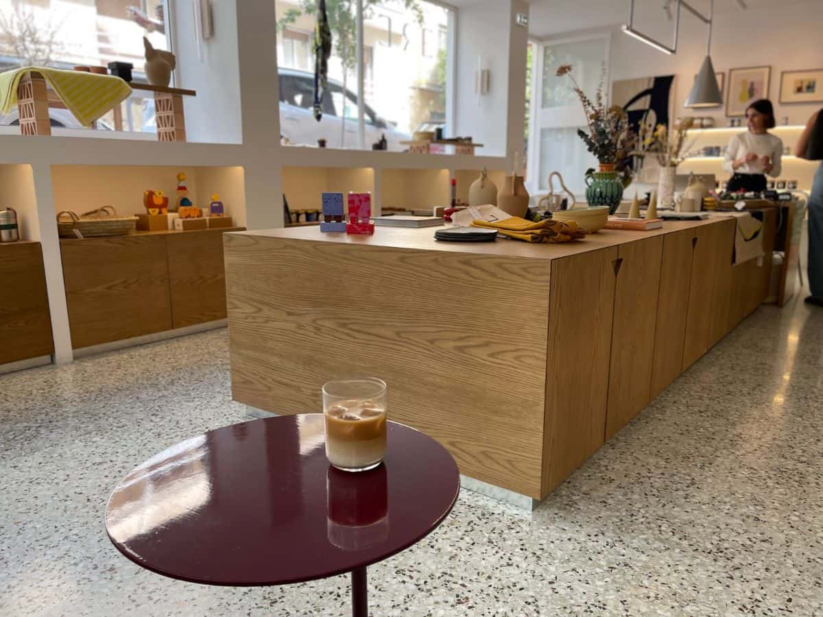 Shop with small table and coffee in a glass