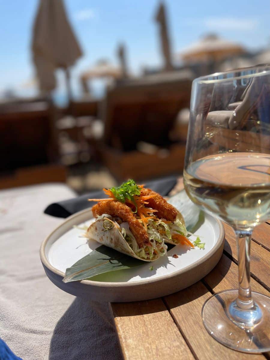 fish tacos and a glass of wine at the beach in Mykonos