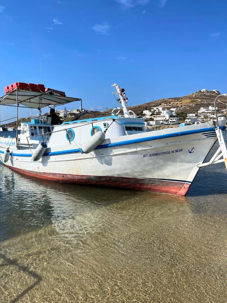 Picture of a water taxi in Mykonos that is half in the water