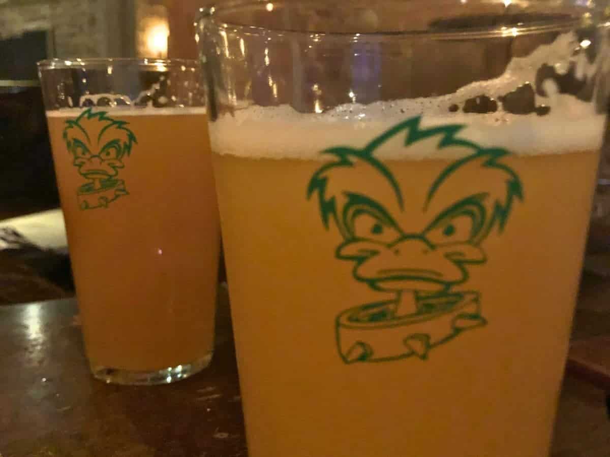 2 pints of beer with a cartoon duck on the glass in Copenhagen.