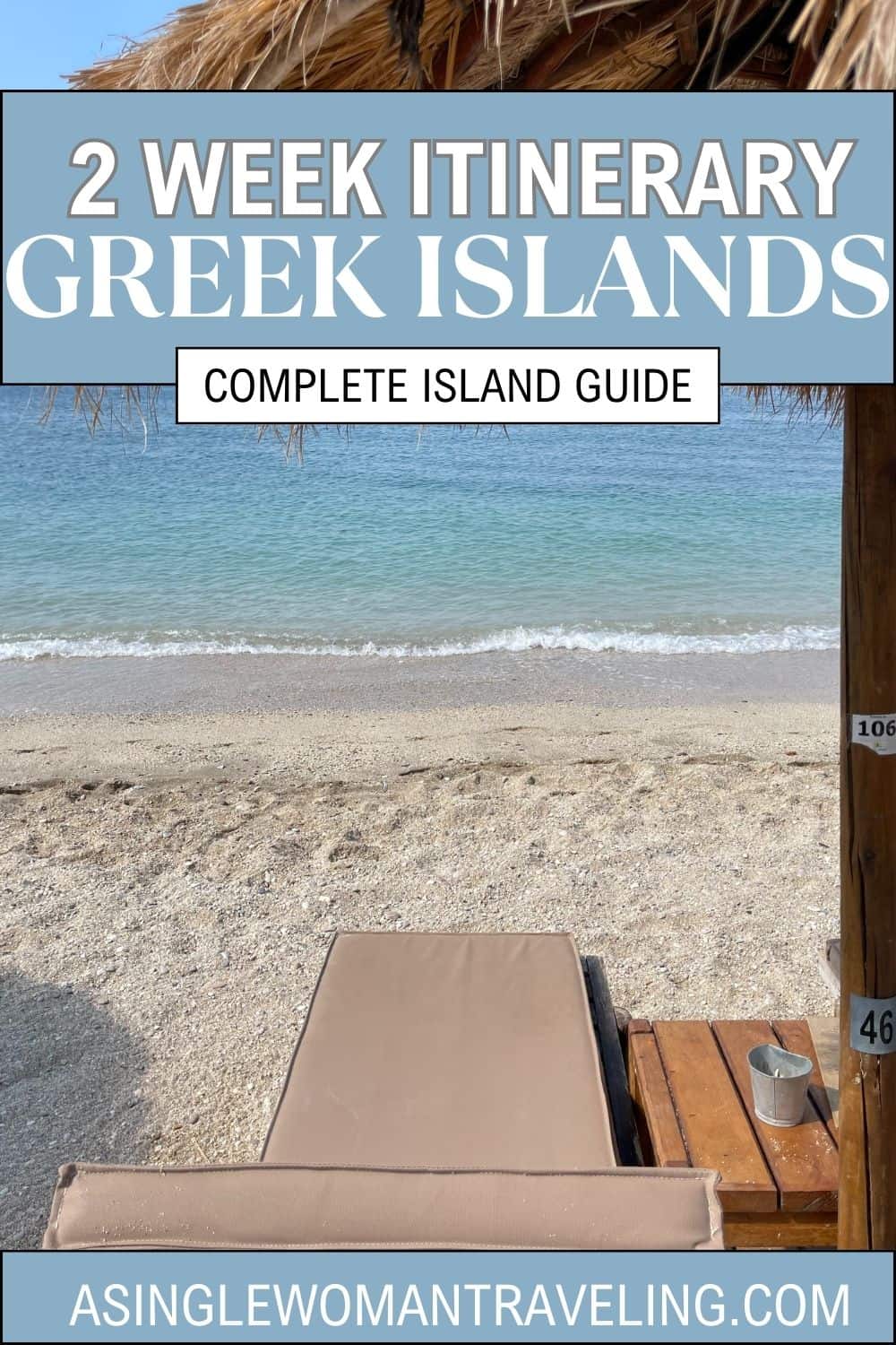 Serene beach scene with a thatched umbrella and a single sunbed facing the clear blue waters of the Aegean Sea, symbolizing the relaxed pace of a complete two-week island guide for the Greek Islands.