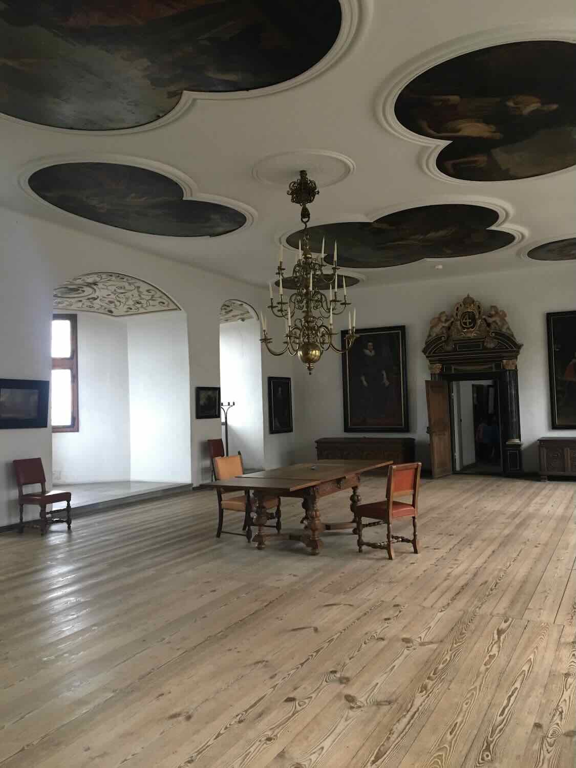 Interior of Kronborg Castle showcasing ornate furnishings and historical artifacts
