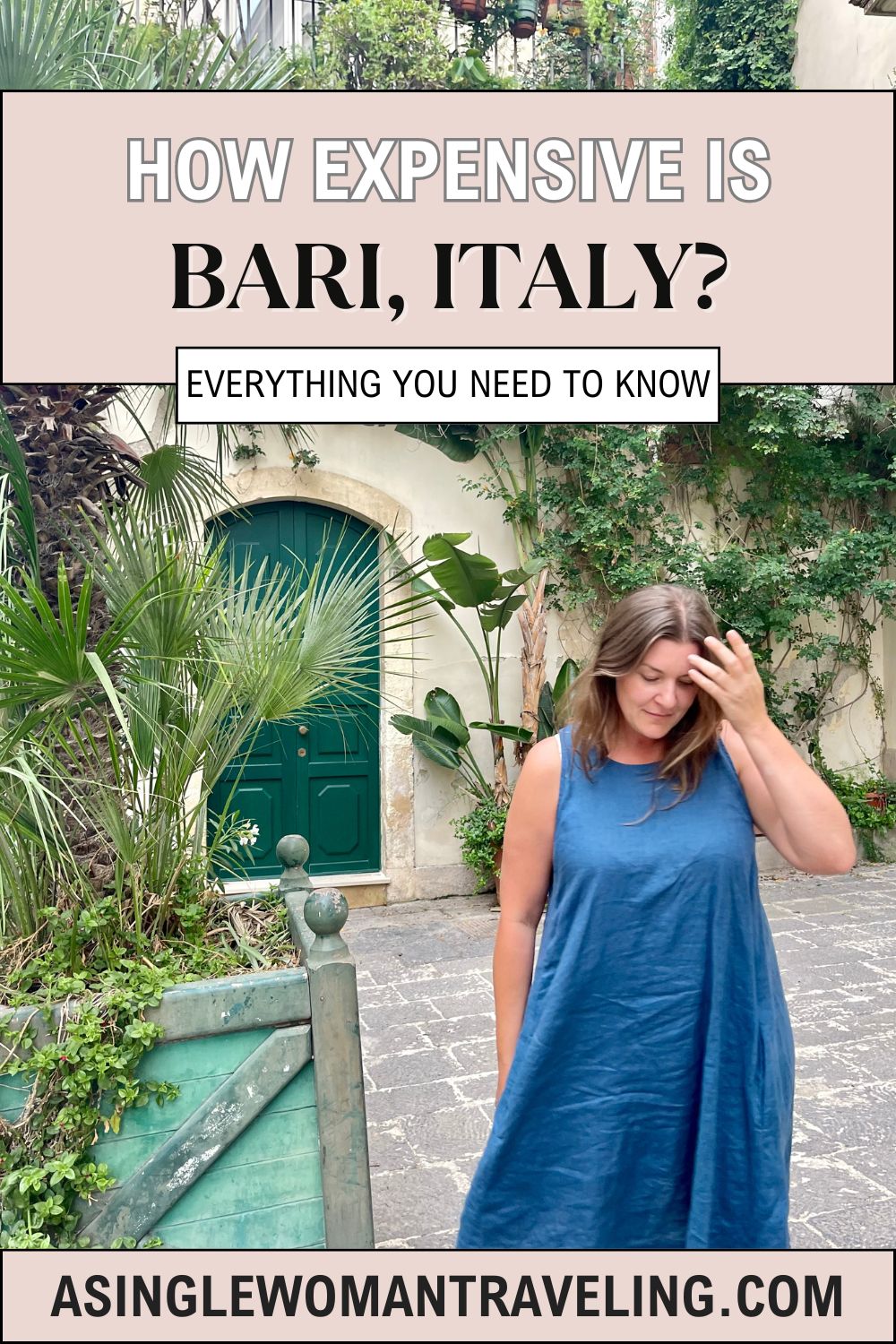 A promotional graphic titled 'How Expensive is Bari, Italy? Everything You Need to Know' with a photo of a woman in a blue dress standing in front of a green door and lush vegetation in Bari. The bottom of the graphic includes the website URL 'asinglewomantraveling.com'.