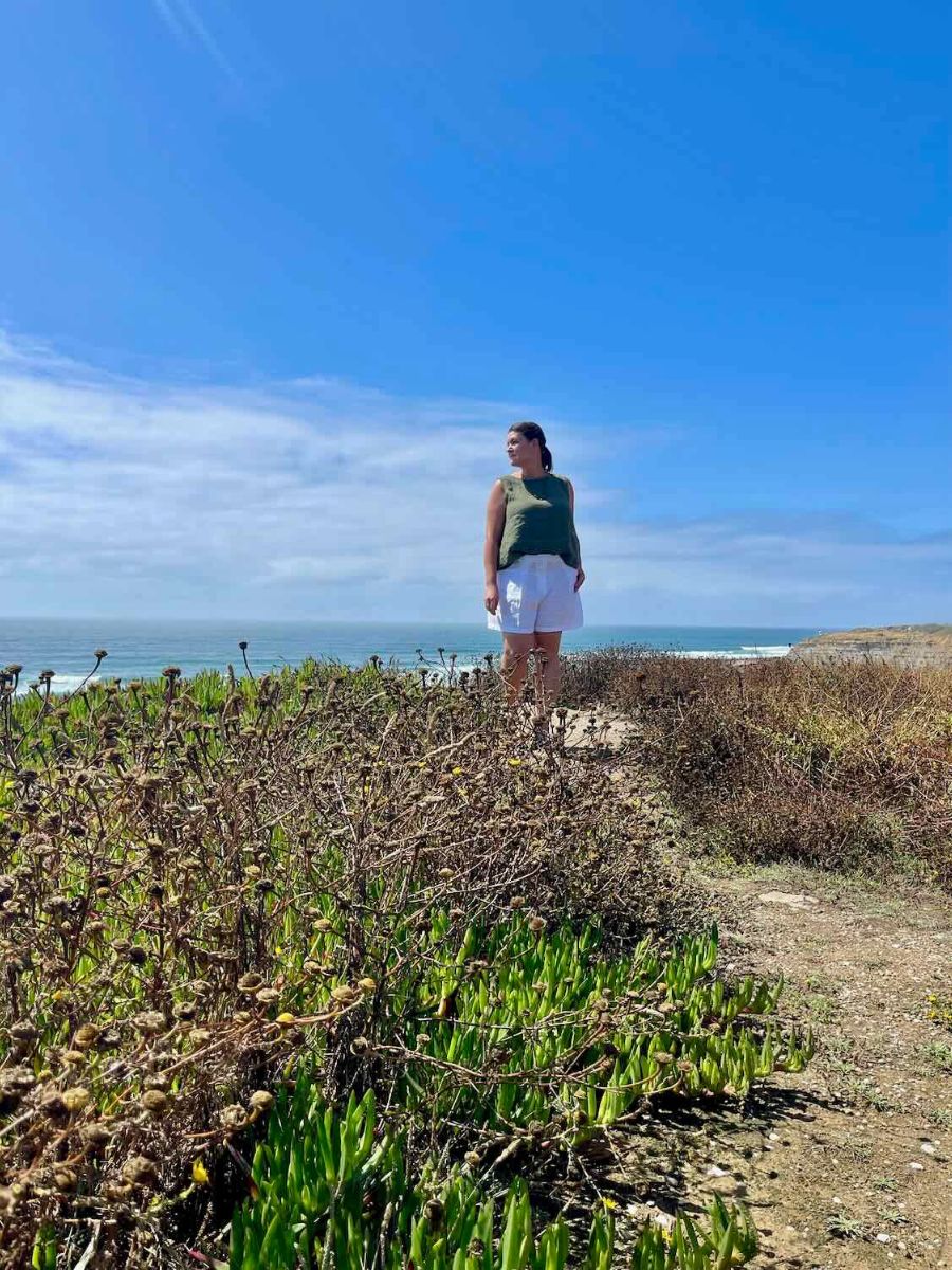 Woman looking out at the ocean in Ericeira