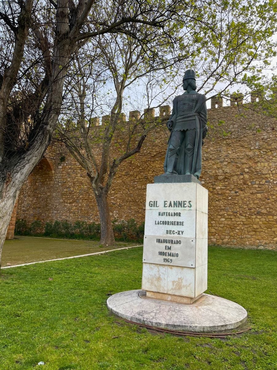 Statue of Gil Eannes, a 15th-century Portuguese navigator, set in front of the medieval city walls in Lagos