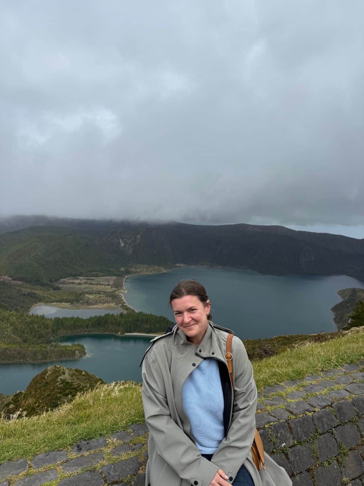 Solo female traveler at Sete Cidades viewpoint in S&atilde;o Miguel, Azores