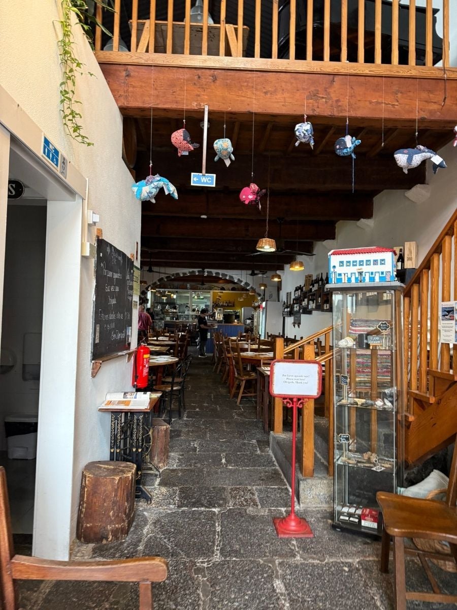 Cozy traditional restaurant interior with wooden decor in Ponta Delgada, S&atilde;o Miguel, Azores