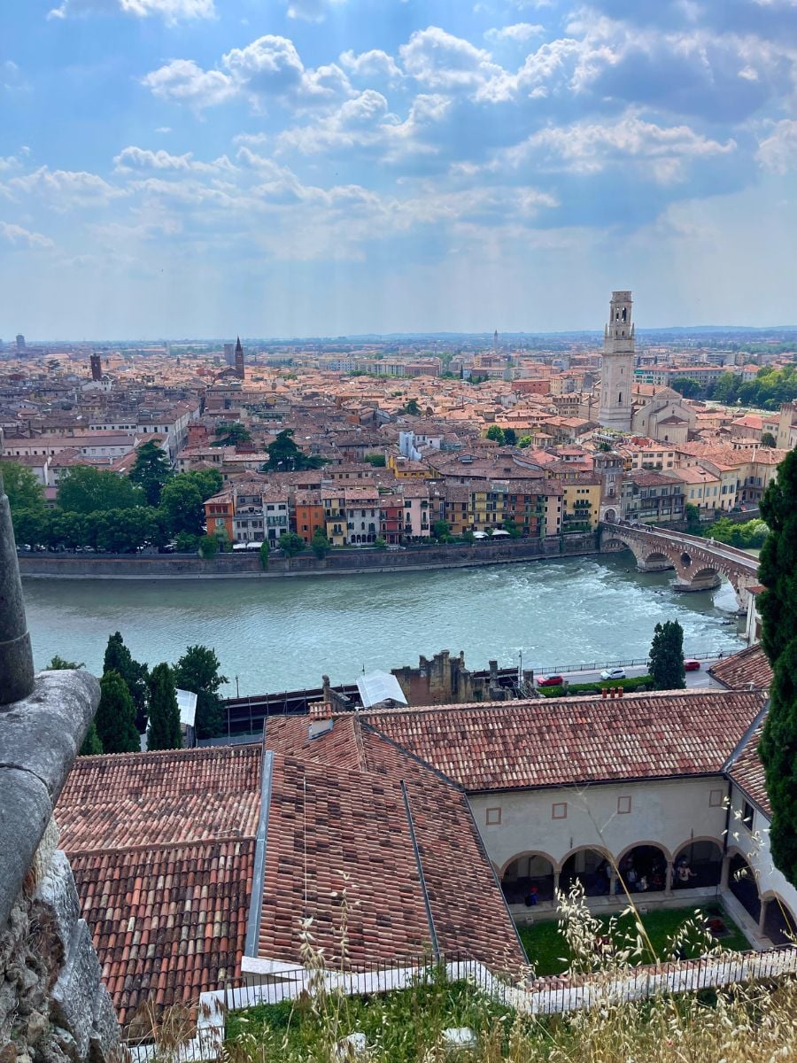 View over Verona with the Adige River, historic bridge, and city skyline from above