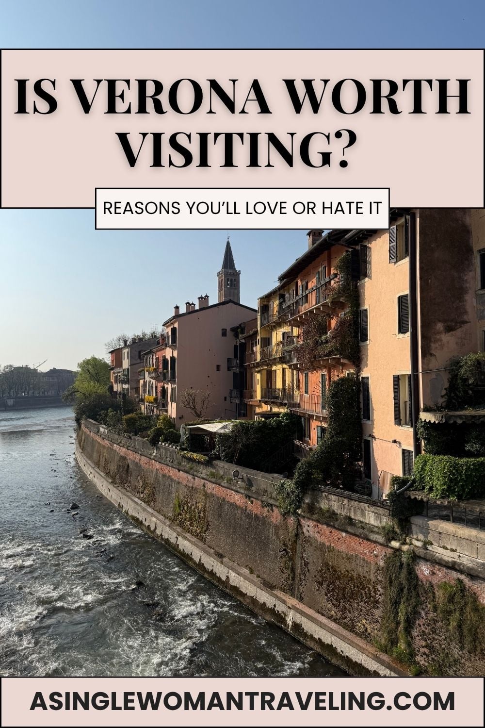 View of Verona along the Adige River with pastel buildings and a church tower at sunset