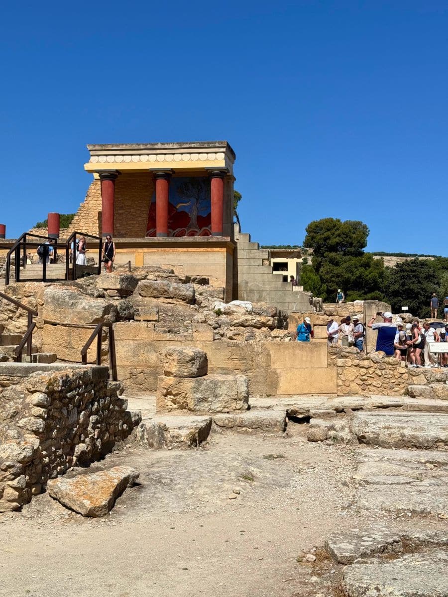 Wide view of the restored North Entrance and surrounding ruins at the Palace of Knossos near Heraklion, Crete.