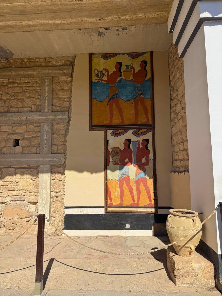 Reconstructed Minoan frescoes depicting attendants carrying ceremonial vessels at the Palace of Knossos in Crete.
